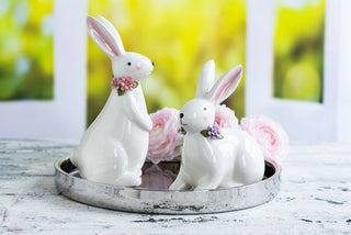 WHITE RABBIT STANDING WITH FLOWERS
